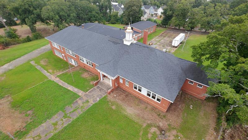 Aerial photo of a historic structure site used for roofline and facade inspection planning